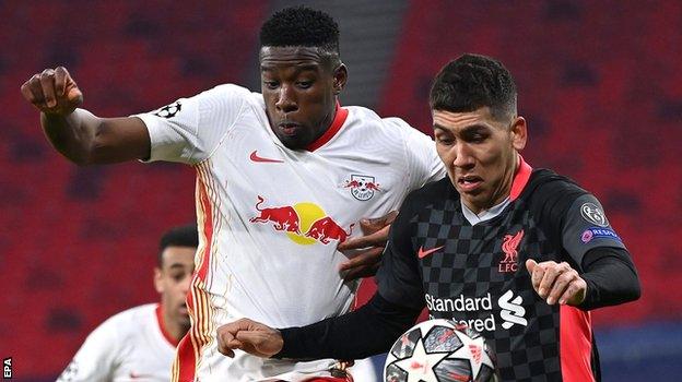 Liverpool's Roberto Firmino challenges Nordi Mukiele