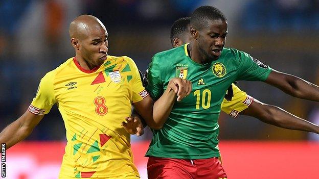 Arnaud Djoum (right) in action for Cameroon