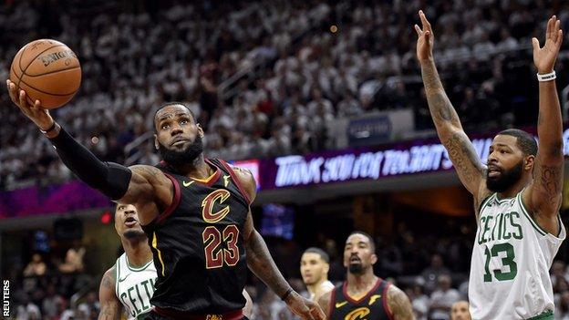 Boston Celtics' Marcus Morris attempts to block LeBron James of Cleveland Cavaliers