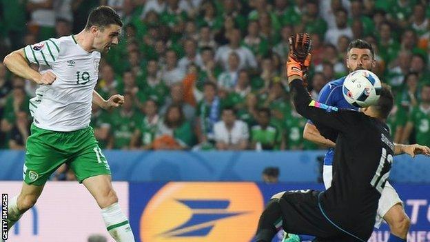 Robbie Brady heads the ball past Italy's keeper