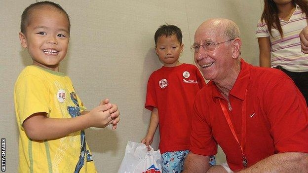 Sir Bobby Charlton visits a local orphanage in Guangzhou