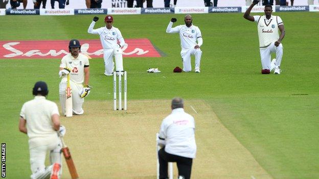 England and West Indies players take a knee