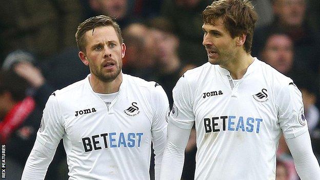 Gylfi Sigurdsson and Fernando Llorente of Swansea City