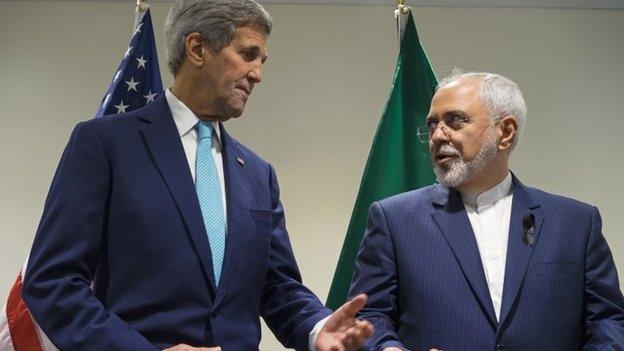 In this Saturday, Sept. 26, 2015 file photo, US Secretary of State John Kerry, left, meets with Iranian Foreign Minister Mohammad Javad Zarif at United Nations headquarters.