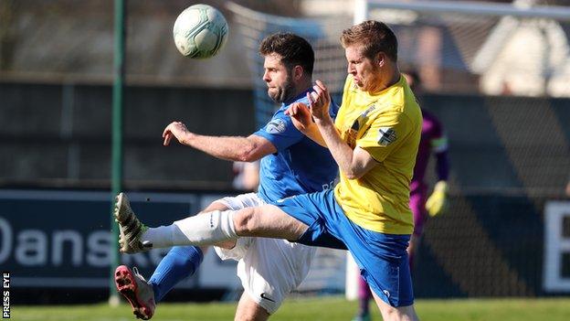 Darren Henderson (right) battles with Glenavon's Simon Kelly last month