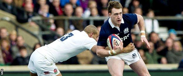 Stuart Hogg is tackled by Jonathan Joseph