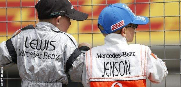 Young boys dressed as Lewis Hamilton and Jenson Button