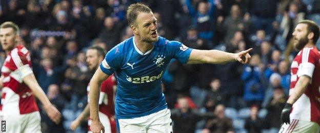 Rangers' Clint Hill celebrates scoring against Hamilton