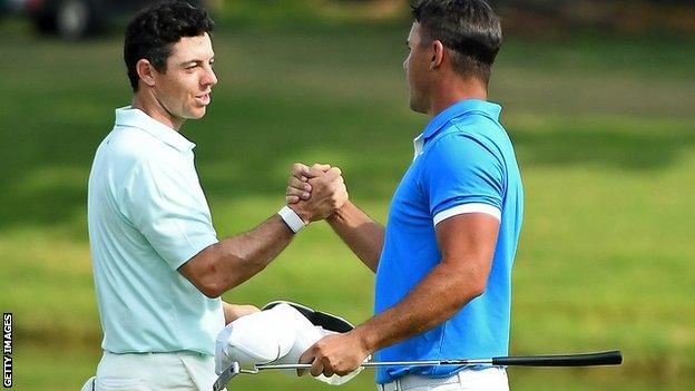 Rory McIlroy shakes the hand of playing partner Brooks Koepka on the final day of the World Golf Championships Invitational in Memphis, United States