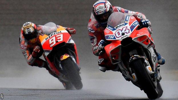 Andrea Dovizioso holds off Marc Marquez