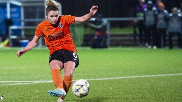 Jo Love scores the winning penalty against Brondby