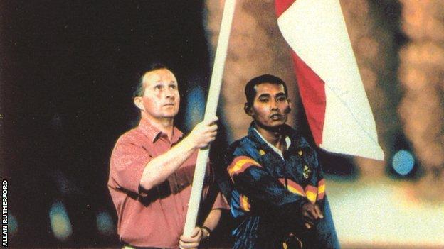 Northern Ireland cricket captain Allan Rutherford held the country's flag at the Games in 1998