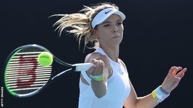 Katie Boulter hitting a return during her Australian Open match against Elina Svitolina