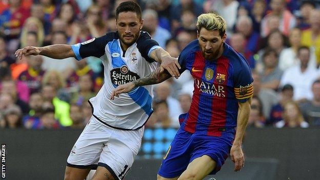 Florin Andone tackles Lionel Messi