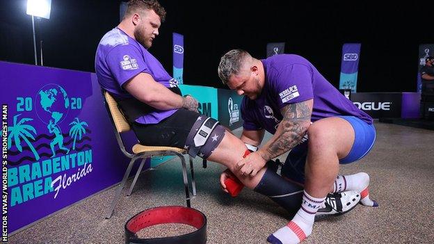 Tom Stoltman receives some running repairs from brother Luke