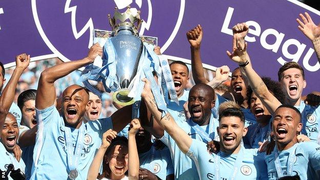 Manchester City lift the Premier League trophy