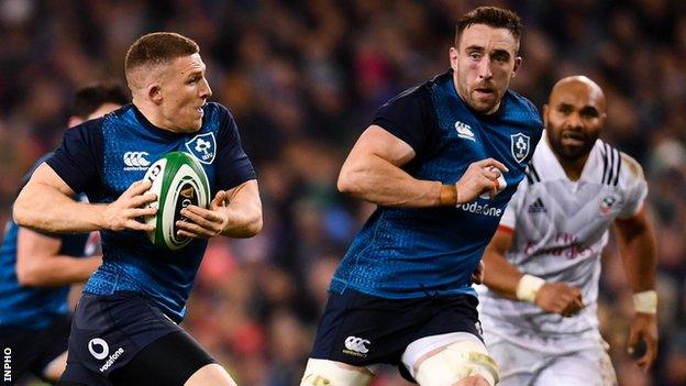 Andrew Conway goes on a run with Jack Conan on his shoulder at the Aviva Stadium