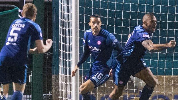 Marios Ogkmpoe (right) celebrates his equalising goal