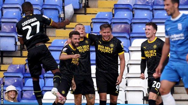 Wigan's Charlie Wyke (fourth from left) celebrates their goal against Birmingham City