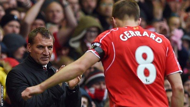 Brendan Rodgers applauds Steven Gerrard as he comes off during a Liverpool match in 2015