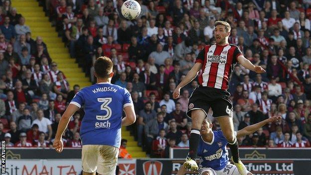 Chris Basham heads Sheffield United ahead against Ipswich