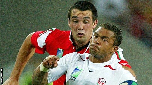 Jason Robinson goes past Wales' Jonathan Thomas at the 2003 World Cup quarter-final in Brisbane