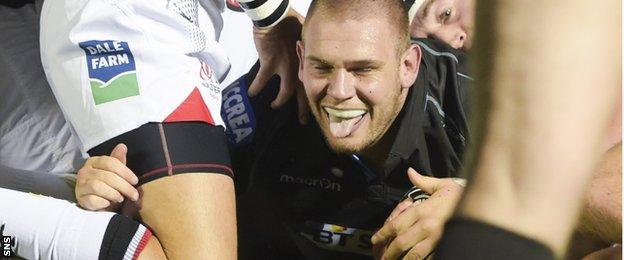 Gordon Reid celebrates after scoring Glasgow's opening try