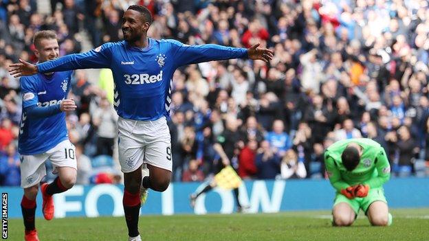 Defoe celebrates after scoring for Rangers