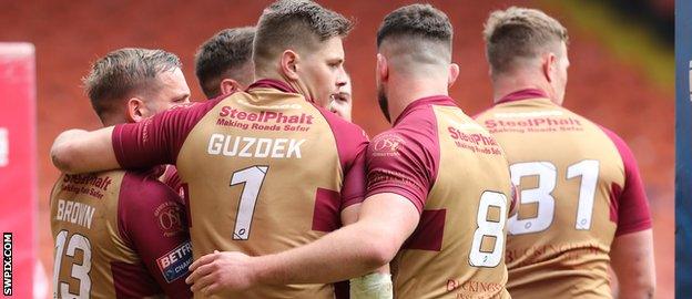 Sheffield Eagles players celebrate a try