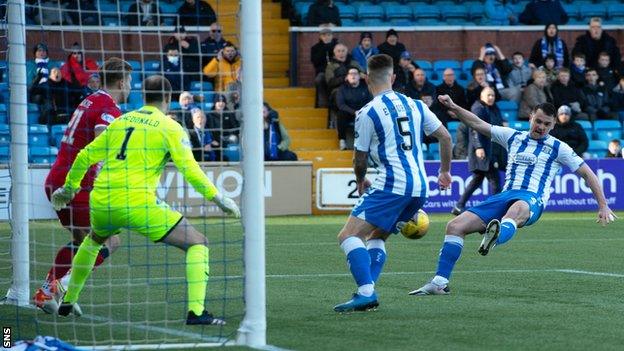 Stephen McGinn scores