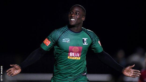 Ade Yusuff of Cray Valley Paper Mills celebrates scoring his side's second goal during the FA Cup Third Qualifying Round match between Cray Valley Paper Mills and Aveley