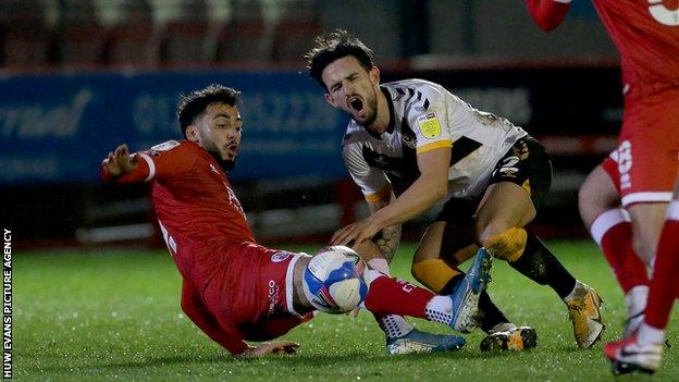 Crawley's Tarryn Allarakhia was sent off for a reckless challenge on Liam Shephard