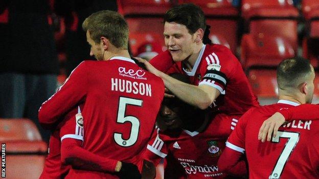 Wrexham players celebrate against Kidderminster Harriers