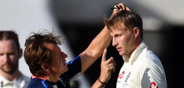 Joe Root receives treatment