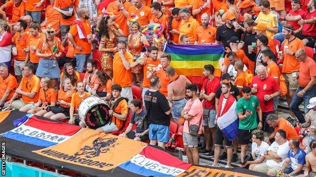 Netherlands fans with a rainbow flag