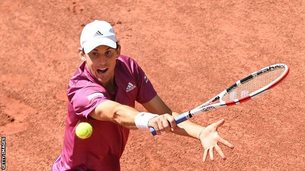 Dominic Thiem hits a backhand