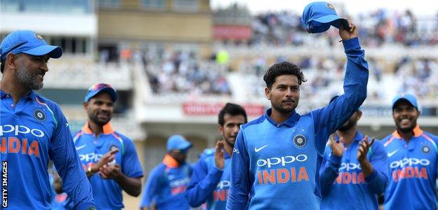 Kuldeep Yadav is applauded off the field after taking 6-25 for India