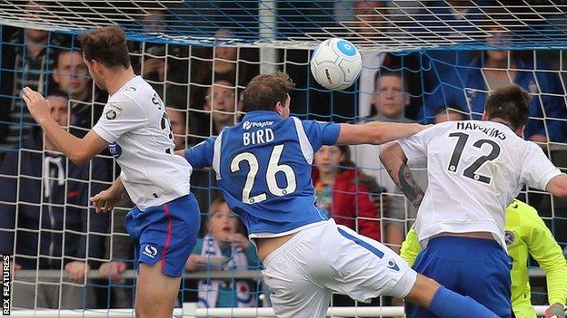 Ryan Birds heads towards goal for Eastleigh