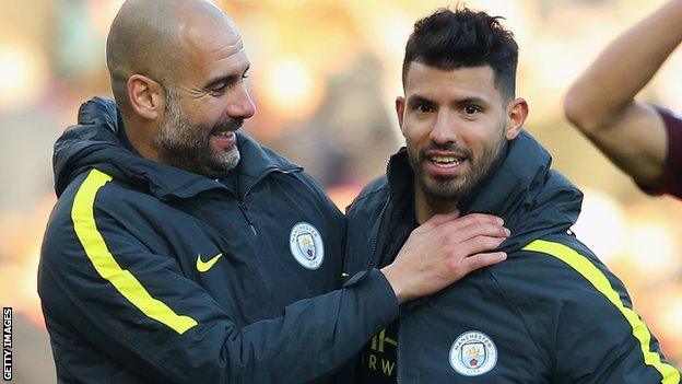 Manchester City manager Pep Guardiola (left) and striker Sergio Aguero