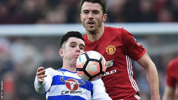 Reading's Liam Kelly shields the ball from Manchester United midfielder Michael Carrick in January's FA Cup tie