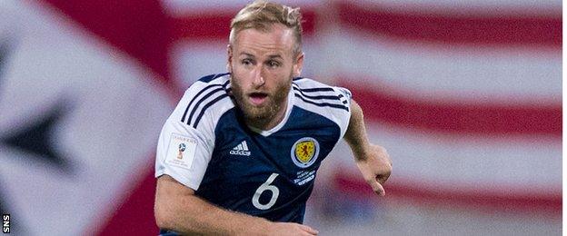 Barry Bannan drives forward for Scotland