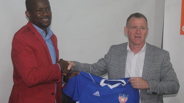 Liberia FA president Mustapha Raji (left) with coach Peter Butler