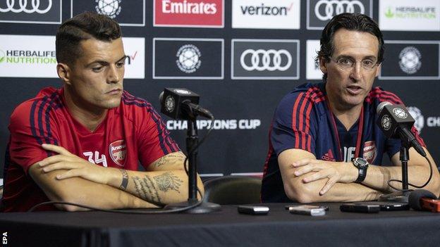 Granit Xhaka and Unai Emery at a news conference in the United States