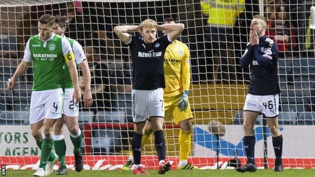 Substitute Matthew Henvey (right) reacts after missing a late header