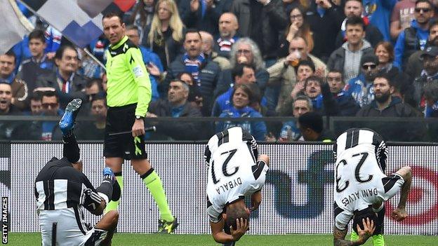 Juan Cuadrado celebrates with forward roll