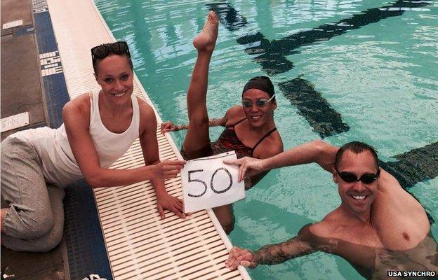 Kristina Lum Underwood and Bill May posing in the water