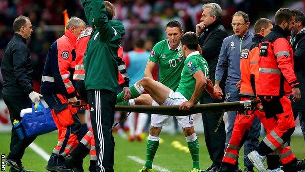 Southampton striker Shane Long is carried off during the Republic of Ireland's 2-1 defeat by Poland