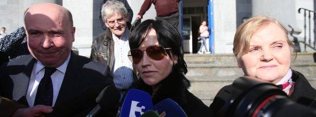 Cranberries singer Dolores O'Riordan leaves Ennis District Court with her mother Eileen and solicitor Bill O'Donnell