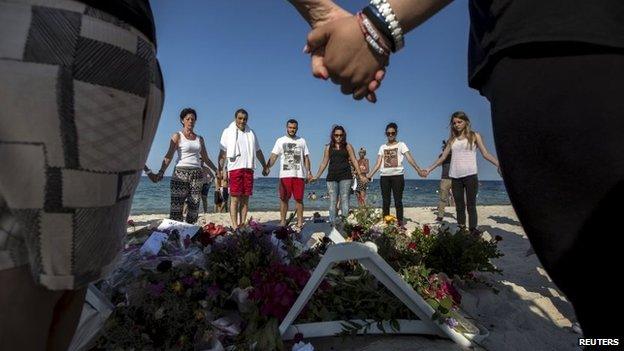 Mourners on beach