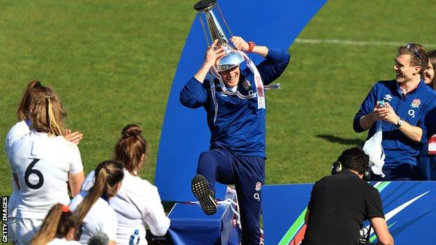 Simon Middleton dances with the trophy on his head